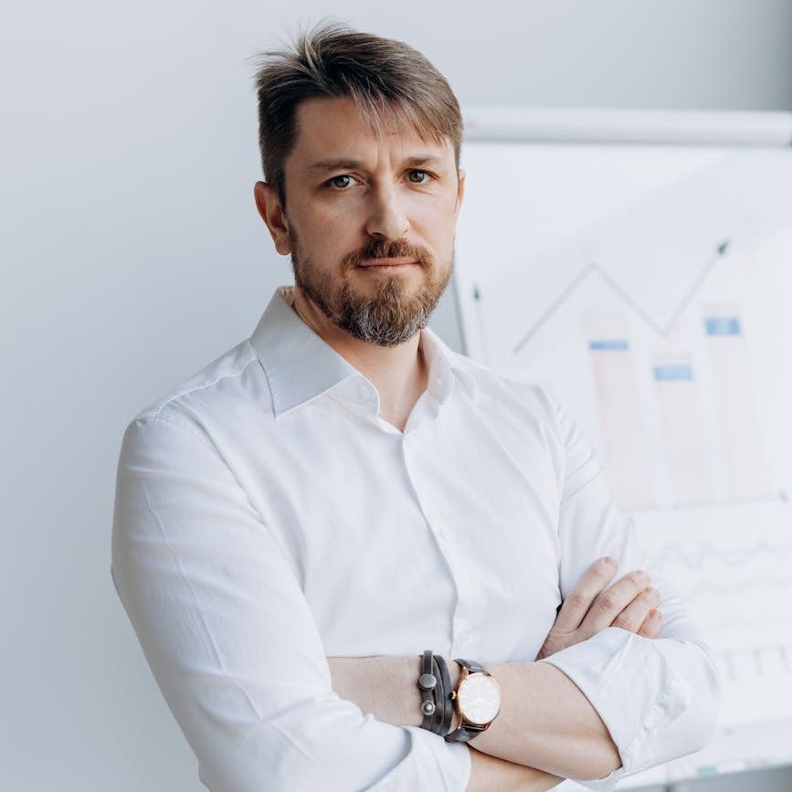 a businessman wearing white long sleeves